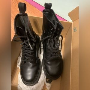 Black Dr.Marten with a box